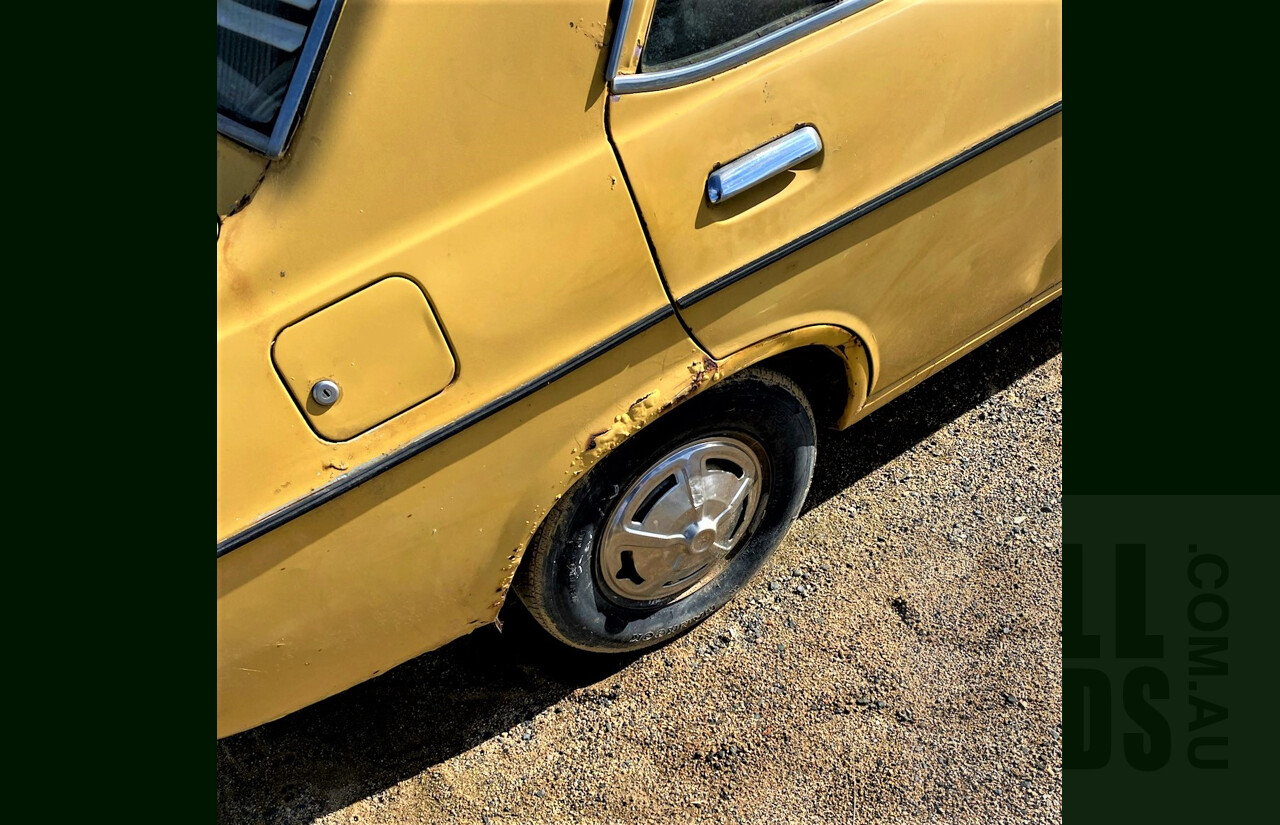 8/1973 Datsun 1200 Deluxe Sedan Yellow 1.2L