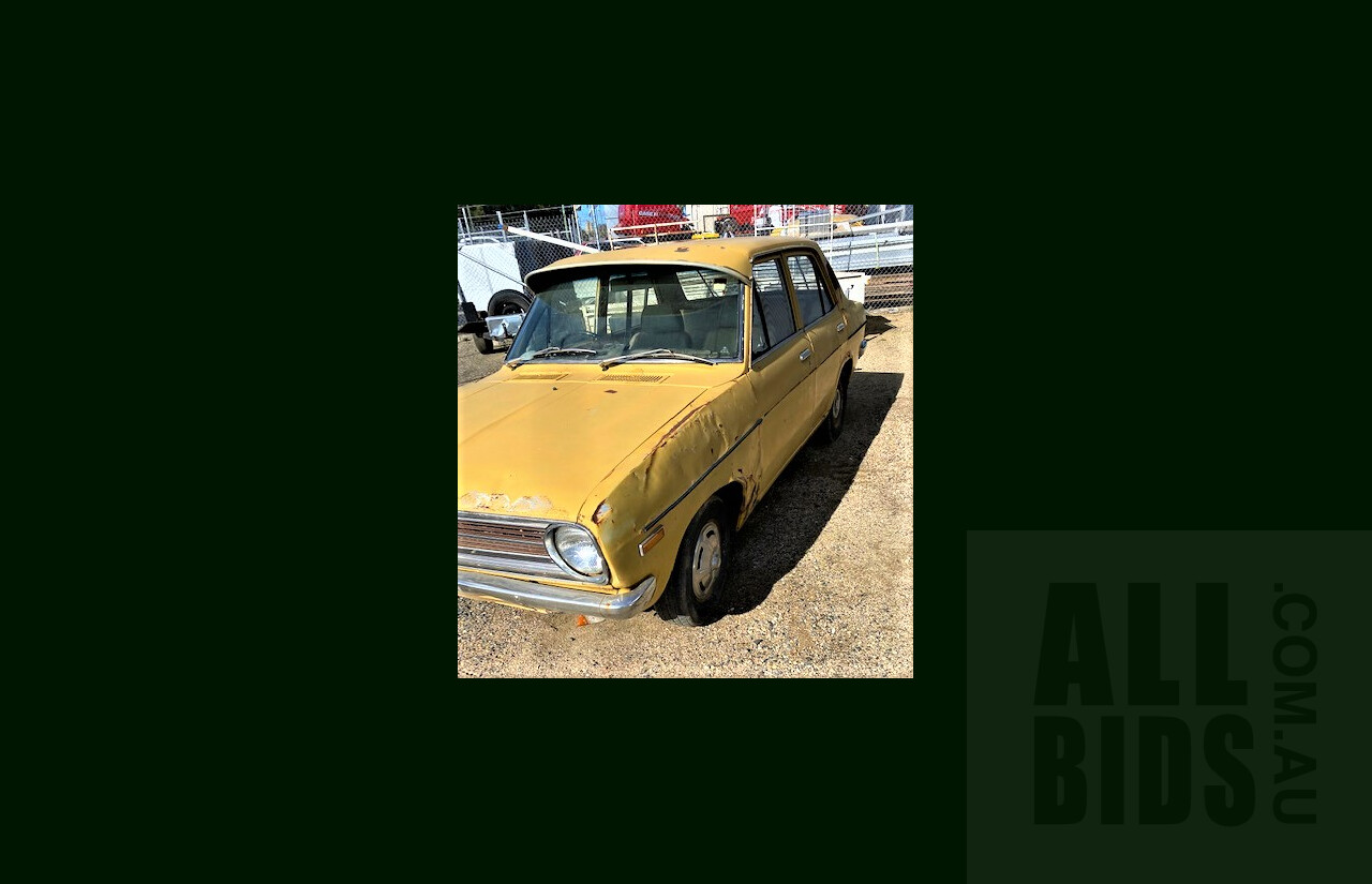 8/1973 Datsun 1200 Deluxe Sedan Yellow 1.2L