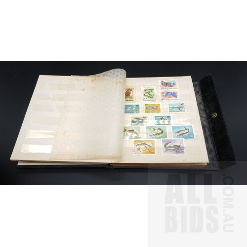 Four Stamp Collector Books, One Stamp album and a Small Collection of Australian and International Stamps