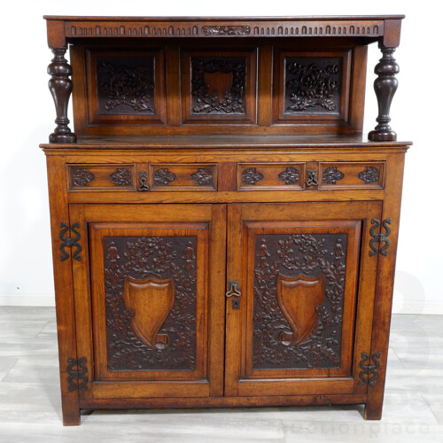 Nice Antique European Oak Cabinet With Nice Wrought Iron Hardware and Profusely Carved Shield and Acorn Panels