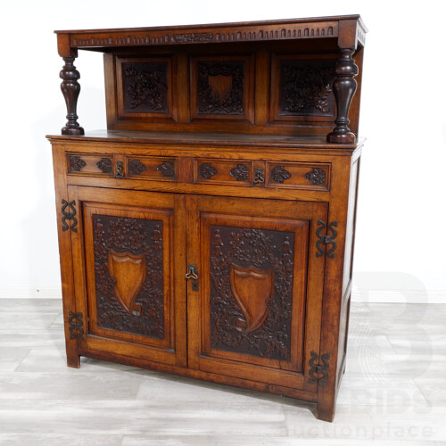 Nice Antique European Oak Cabinet With Nice Wrought Iron Hardware and Profusely Carved Shield and Acorn Panels