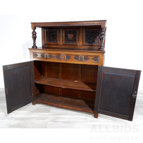 Nice Antique European Oak Cabinet With Nice Wrought Iron Hardware and Profusely Carved Shield and Acorn Panels