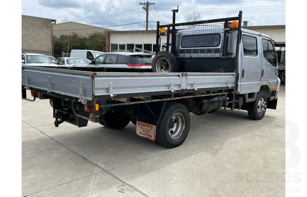 6/2004 Mitsubishi Canter FE649 MWB C/Chas Silver 3.9L