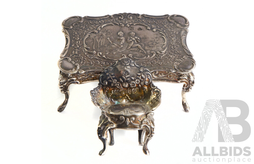 Antique Sterling Silver Minaiture Dolls House Table and Two Chairs with Heavilly Repoussed Detail, London 1897