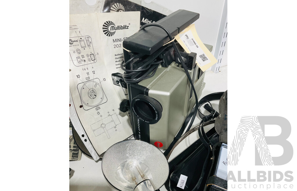 Very Large Vintage Collection of Camera and Photograph Memorabilia Including Several Promotional Posters, a Leica Pradovit P 150 Slide Projector with 85mm F/2.8 Hektor-P2 Lens, S-F 400 Flash Meter and More