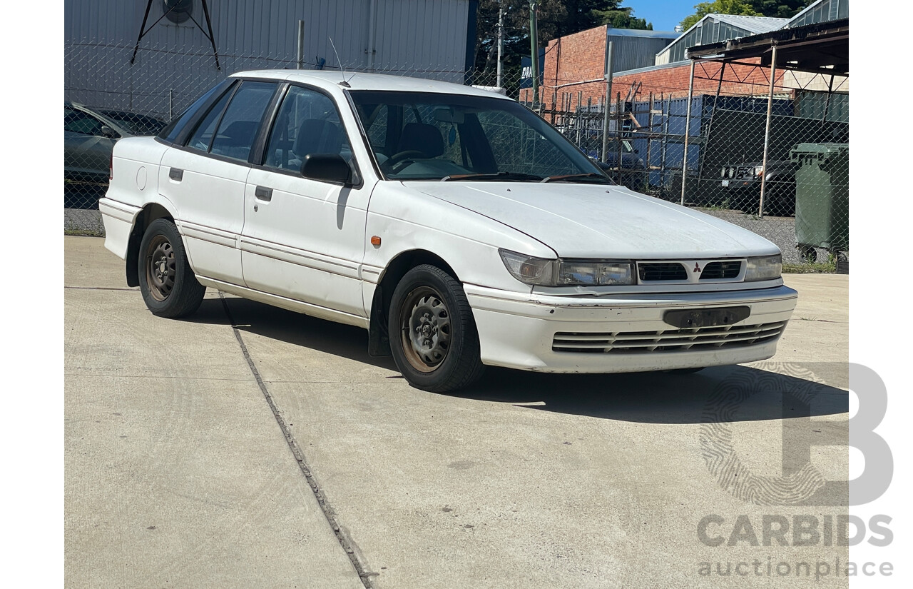 9/1993 Mitsubishi Lancer GLXi CC 5d Hatchback White 1.6L