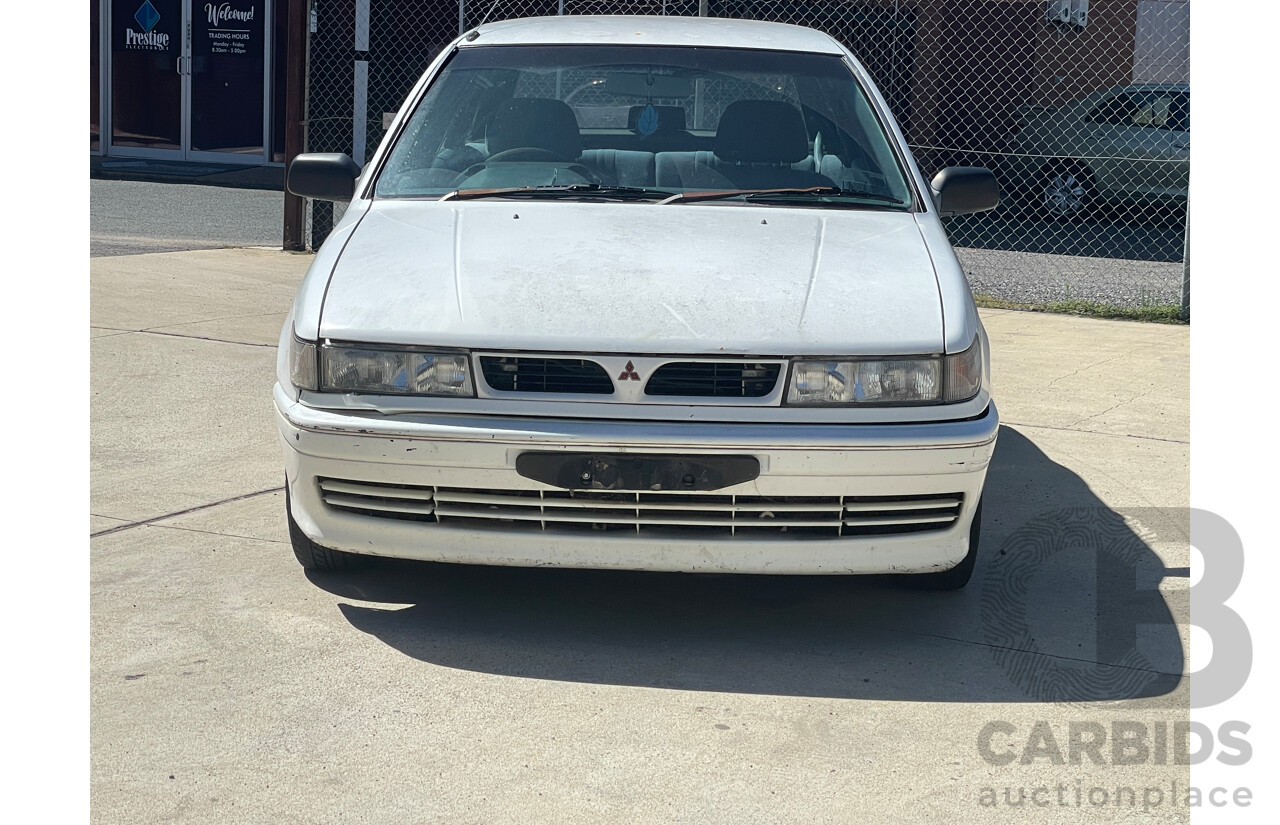 9/1993 Mitsubishi Lancer GLXi CC 5d Hatchback White 1.6L