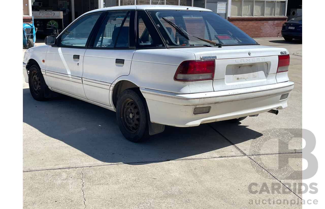 9/1993 Mitsubishi Lancer GLXi CC 5d Hatchback White 1.6L