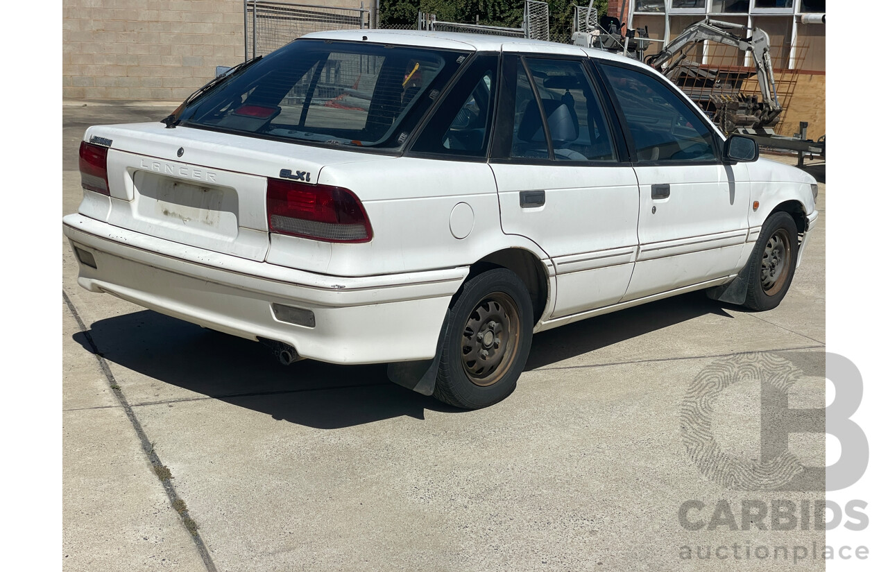 9/1993 Mitsubishi Lancer GLXi CC 5d Hatchback White 1.6L