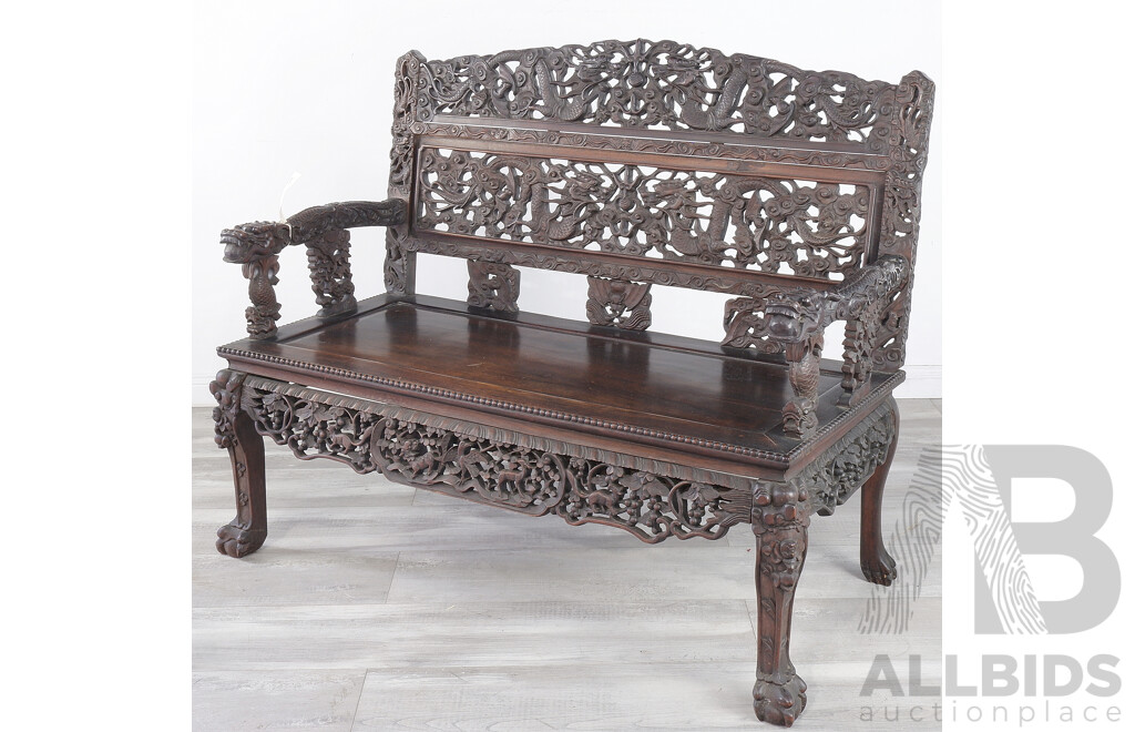 Fine Antique Chinese Hongmu Rosewood Dragon Bench Profusely Carved and Pierced with Dragons and Clouds, Circa 1900