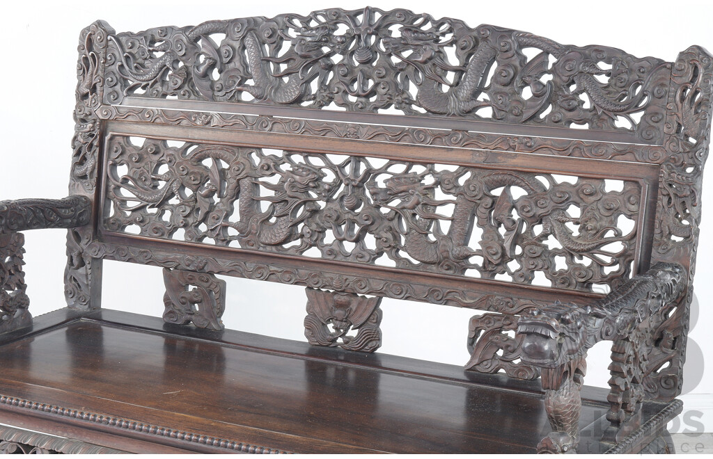 Fine Antique Chinese Hongmu Rosewood Dragon Bench Profusely Carved and Pierced with Dragons and Clouds, Circa 1900