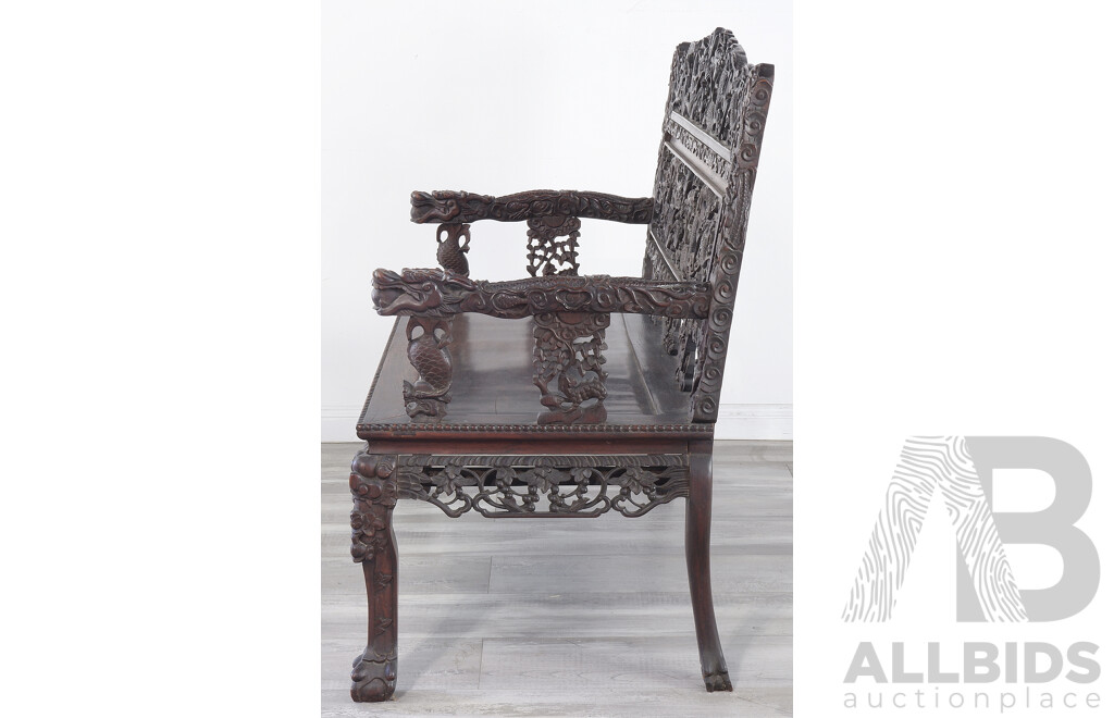Fine Antique Chinese Hongmu Rosewood Dragon Bench Profusely Carved and Pierced with Dragons and Clouds, Circa 1900