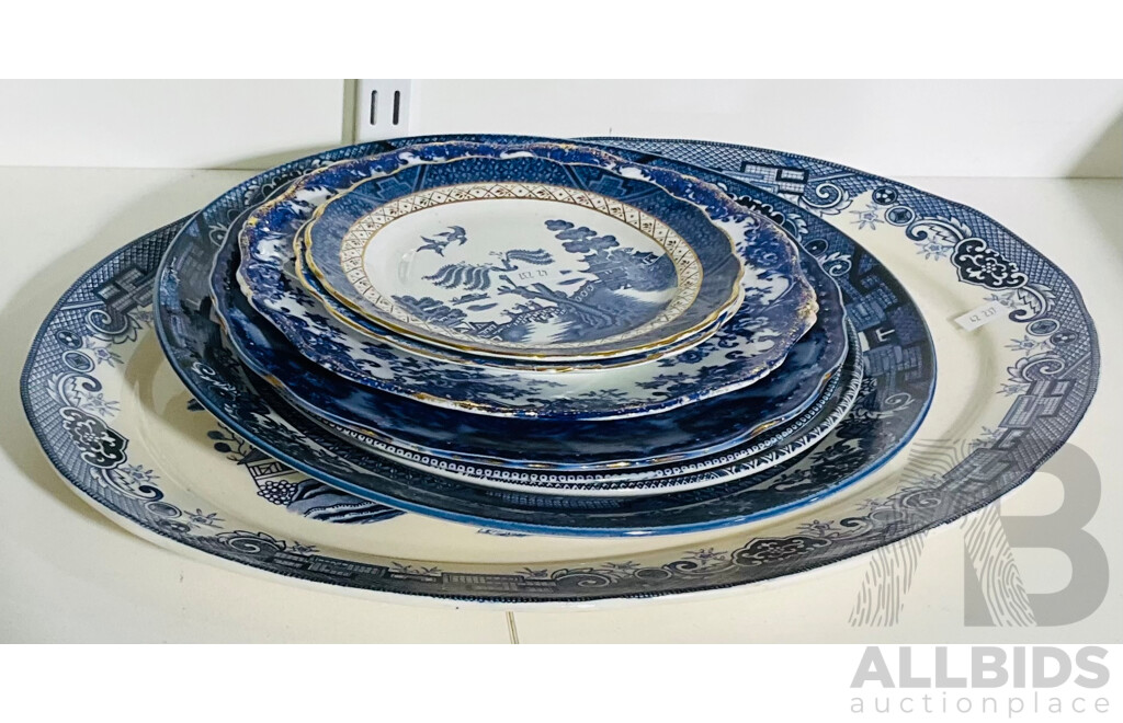 Collection of Eight Plates Ranging From a Large Serving Platter to Two Small Side Plates - Several in Blue Willow Design - Includes Those Made by Portland, J&G Meakin and More