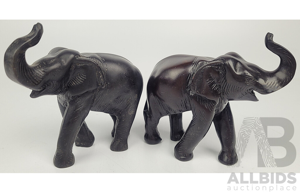 Pair of Carved Dark Resin Elephant Statuettes