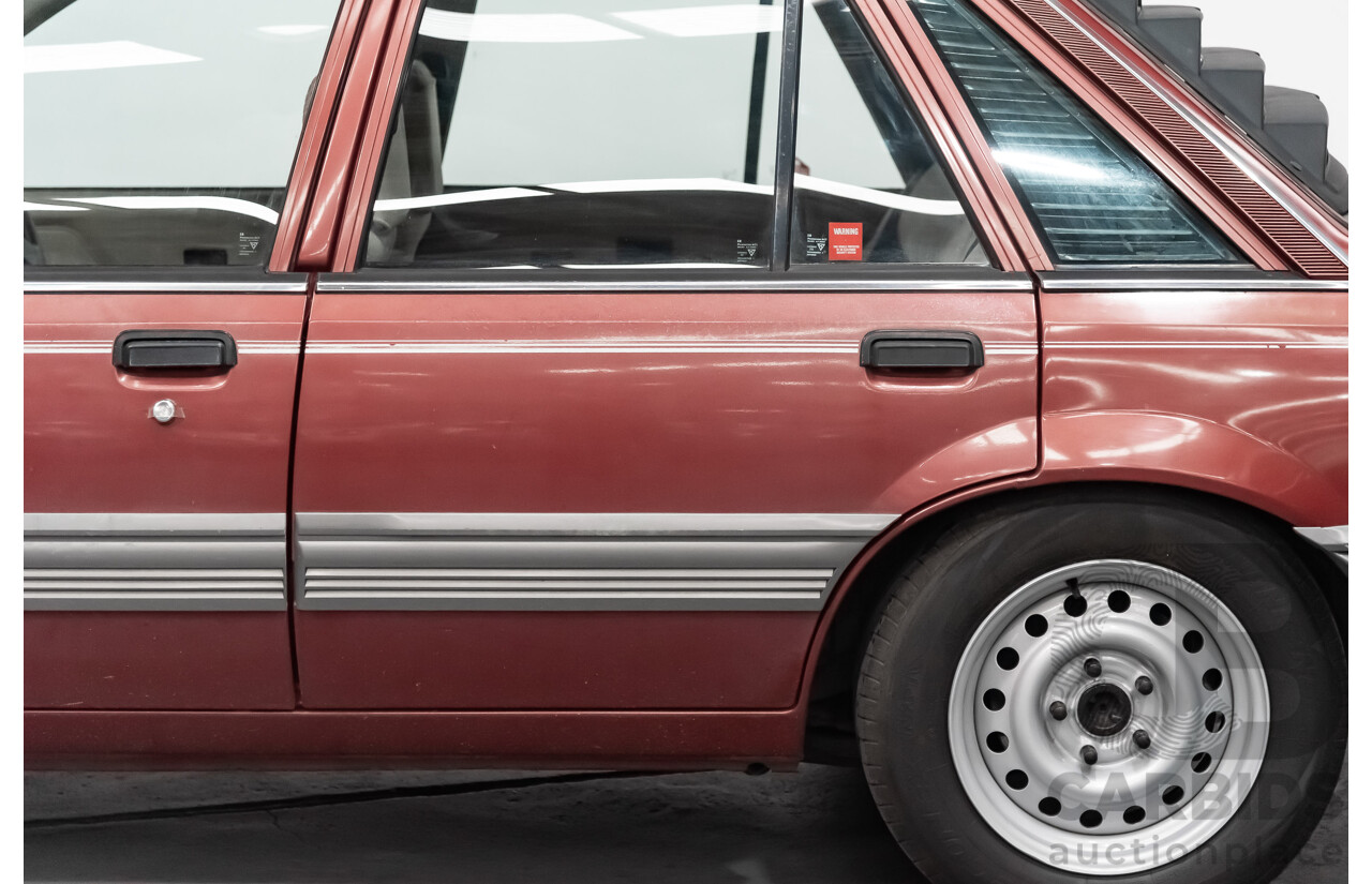 10/1986 Holden Commodore Executive VL 4d Sedan Maroon Turbo 2.5L - Modified