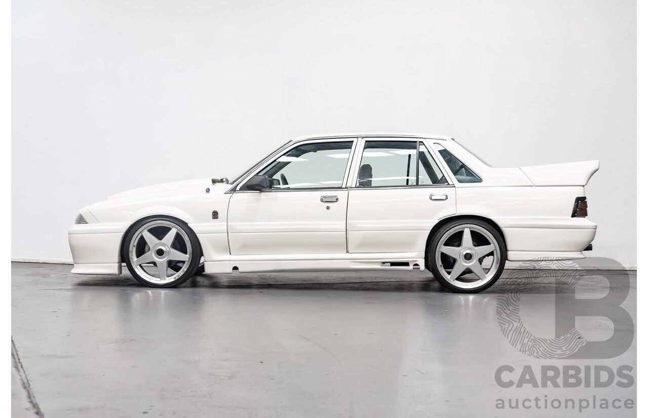 10/1986 Holden Commodore Executive VL 4d Sedan White 5.0L V8 - Walkinshaw Group A SS Tribute