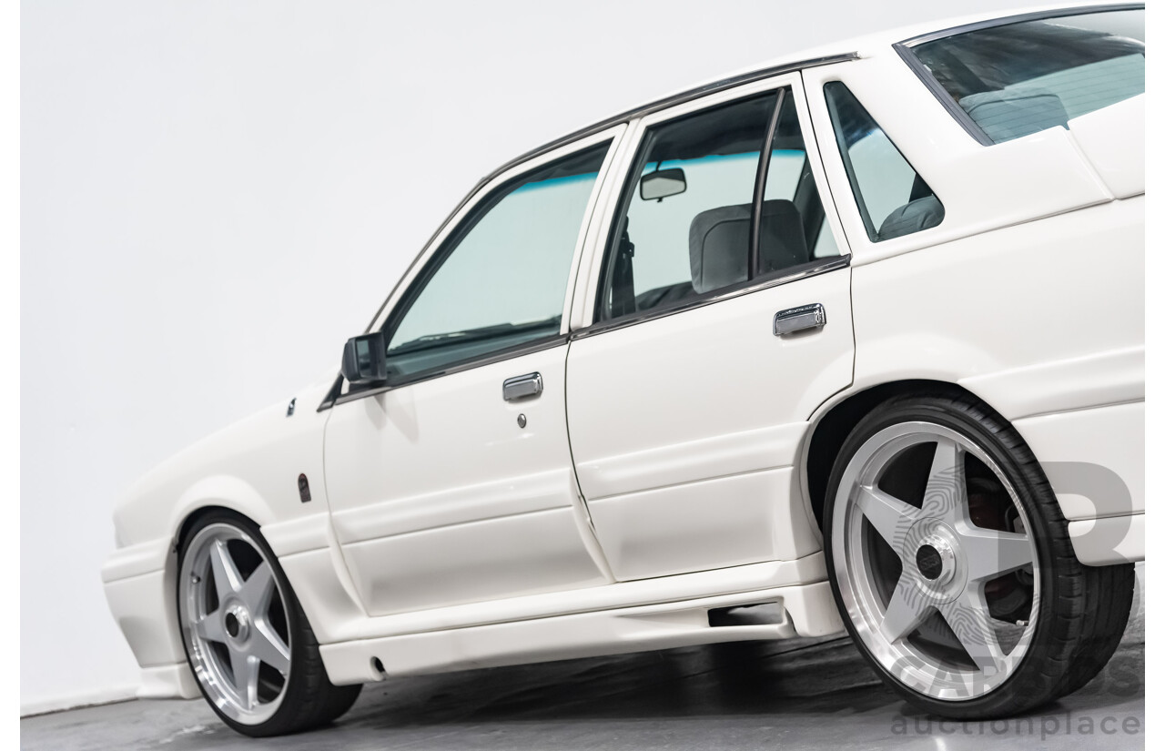 10/1986 Holden Commodore Executive VL 4d Sedan White 5.0L V8 - Walkinshaw Group A SS Tribute