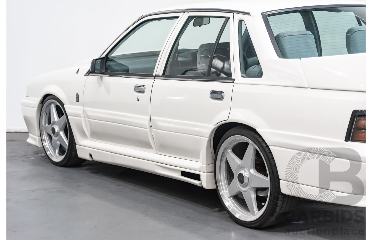 10/1986 Holden Commodore Executive VL 4d Sedan White 5.0L V8 - Walkinshaw Group A SS Tribute