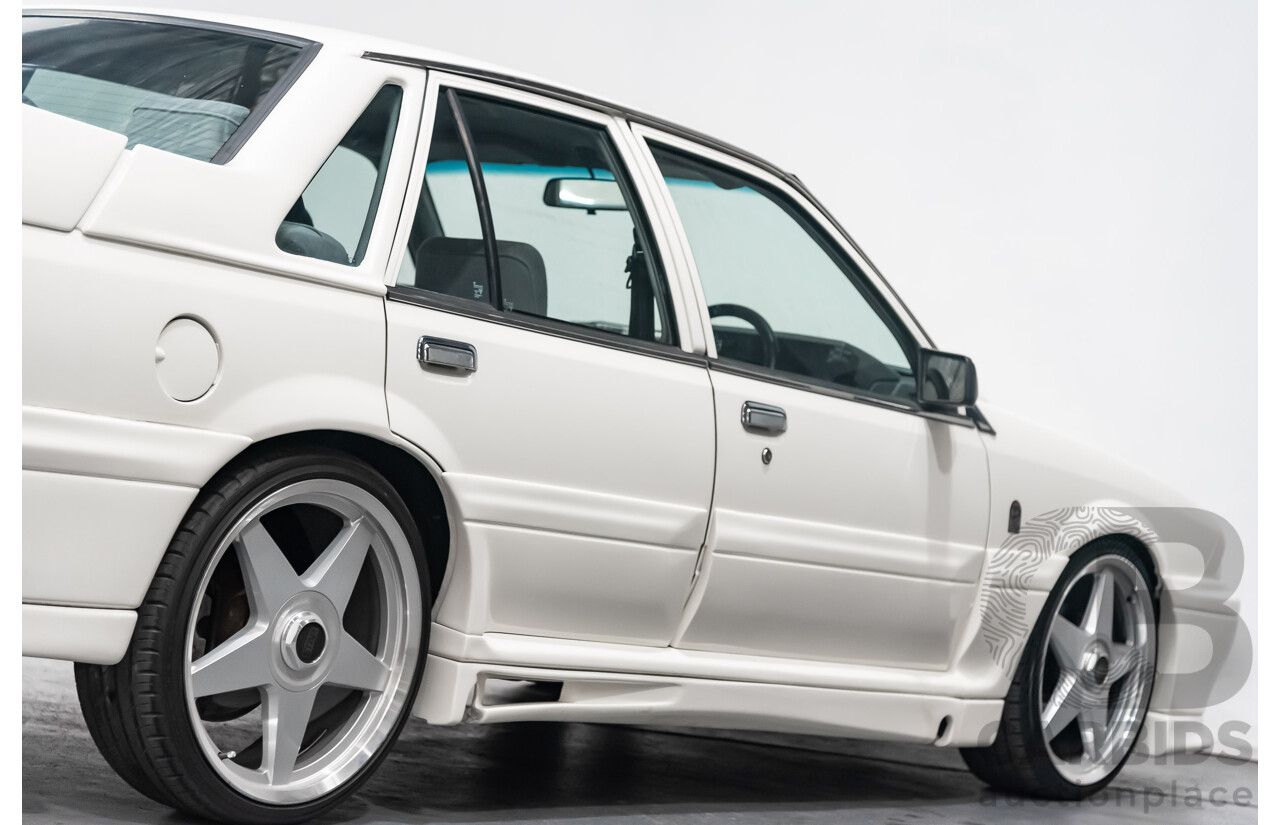 10/1986 Holden Commodore Executive VL 4d Sedan White 5.0L V8 - Walkinshaw Group A SS Tribute