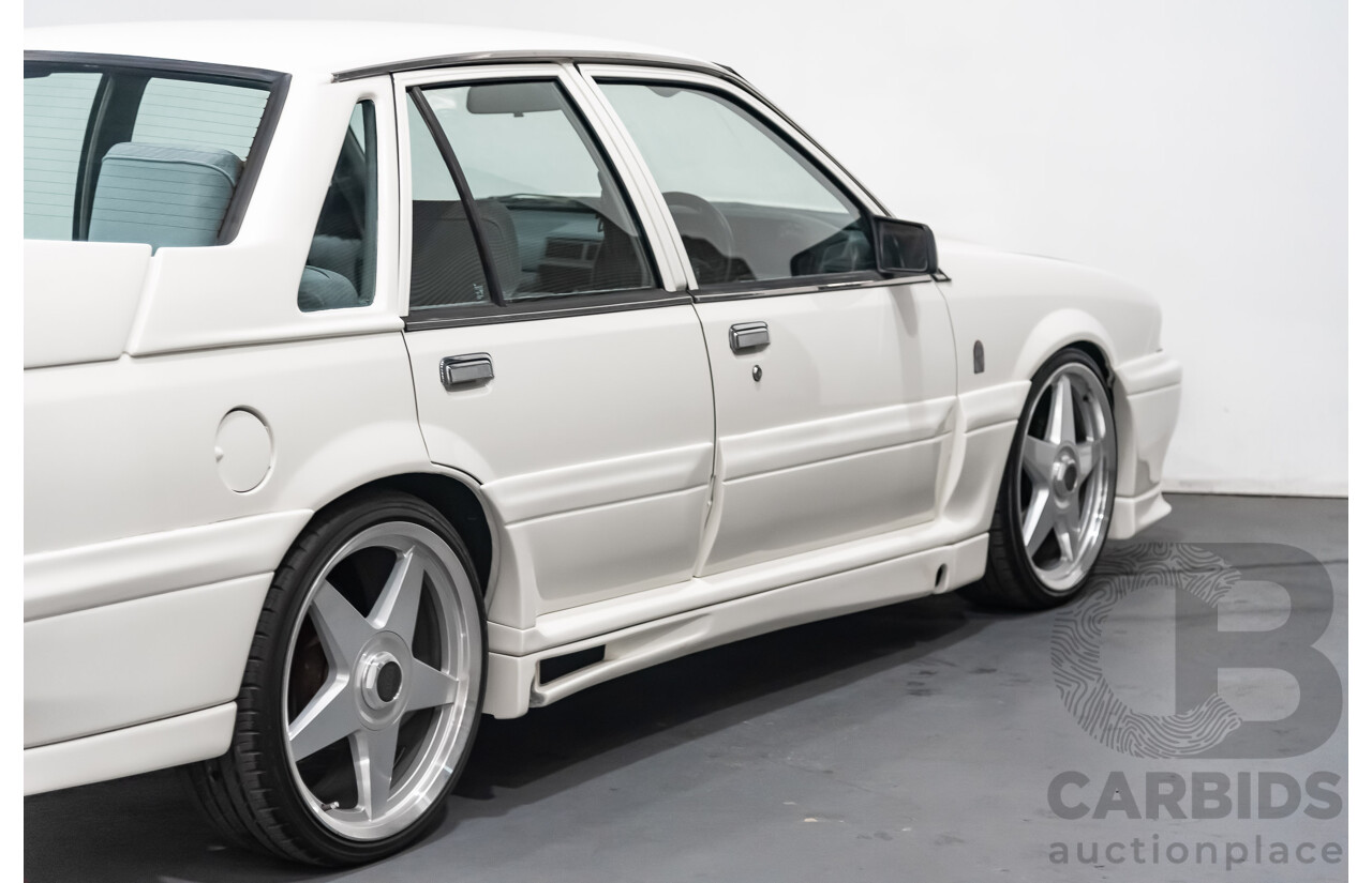 10/1986 Holden Commodore Executive VL 4d Sedan White 5.0L V8 - Walkinshaw Group A SS Tribute