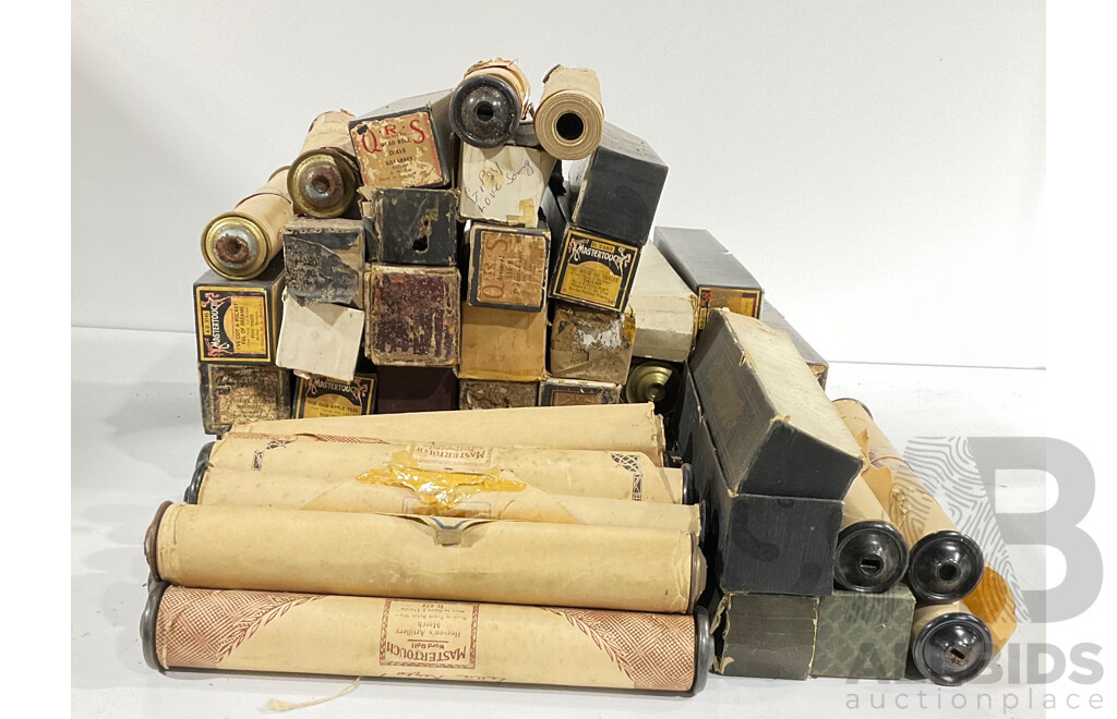 A collection of vintage pianola rolls, approximately 45