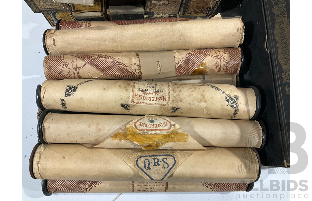 A collection of vintage pianola rolls, approximately 45