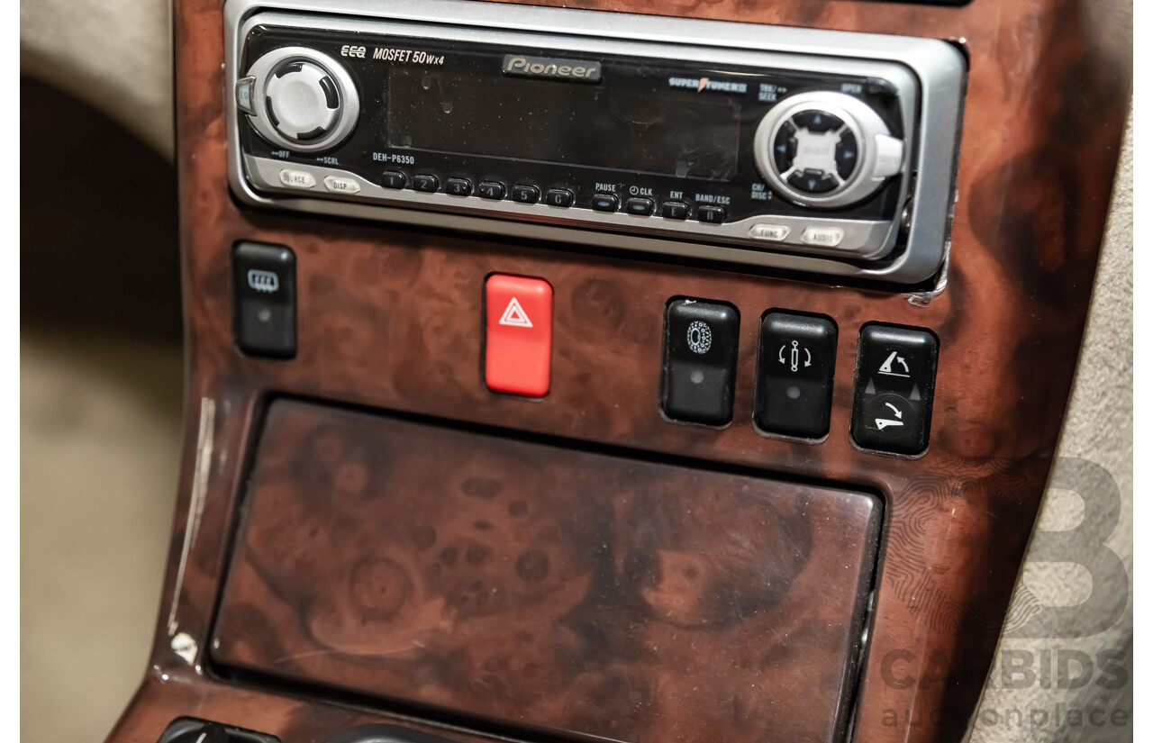 7/1990 Mercedes-Benz 500 SL  2d Convertible Red 5.0L V8