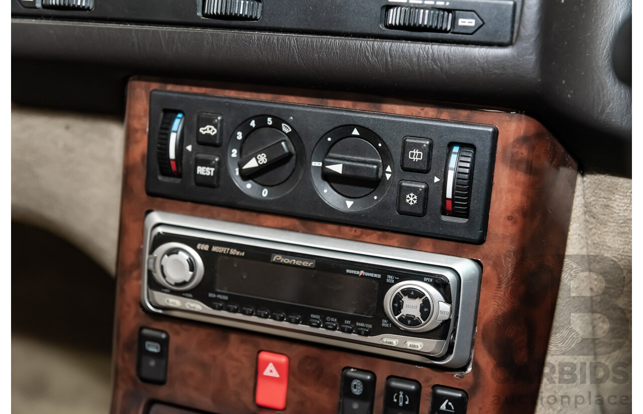 7/1990 Mercedes-Benz 500 SL  2d Convertible Red 5.0L V8