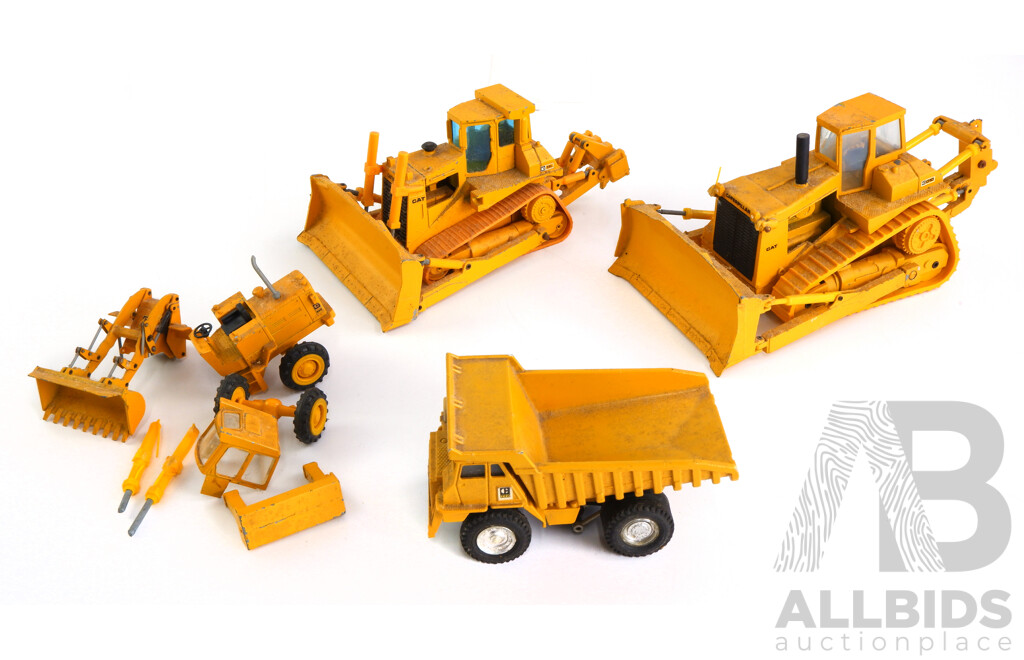 Collection of Model Caterpillar Heavy Vehicles Including 1:50 Scale Conrad CAT D10, NZG 1:50 Scale CAT D8L and Articulating CAT 920