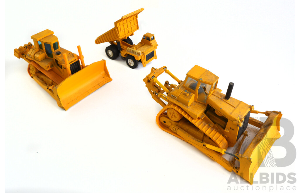 Collection of Model Caterpillar Heavy Vehicles Including 1:50 Scale Conrad CAT D10, NZG 1:50 Scale CAT D8L and Articulating CAT 920