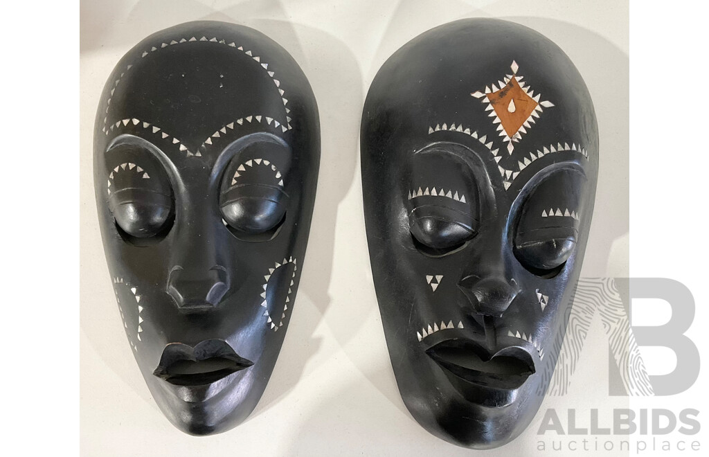 Two Carved Timber Lombok Masks with Mother of Pearl Inlay
