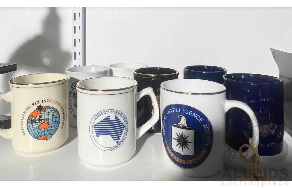 Collection of Eight Various Intellegence Agency Coffee Mugs