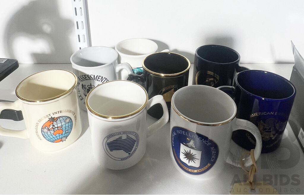 Collection of Eight Various Intellegence Agency Coffee Mugs