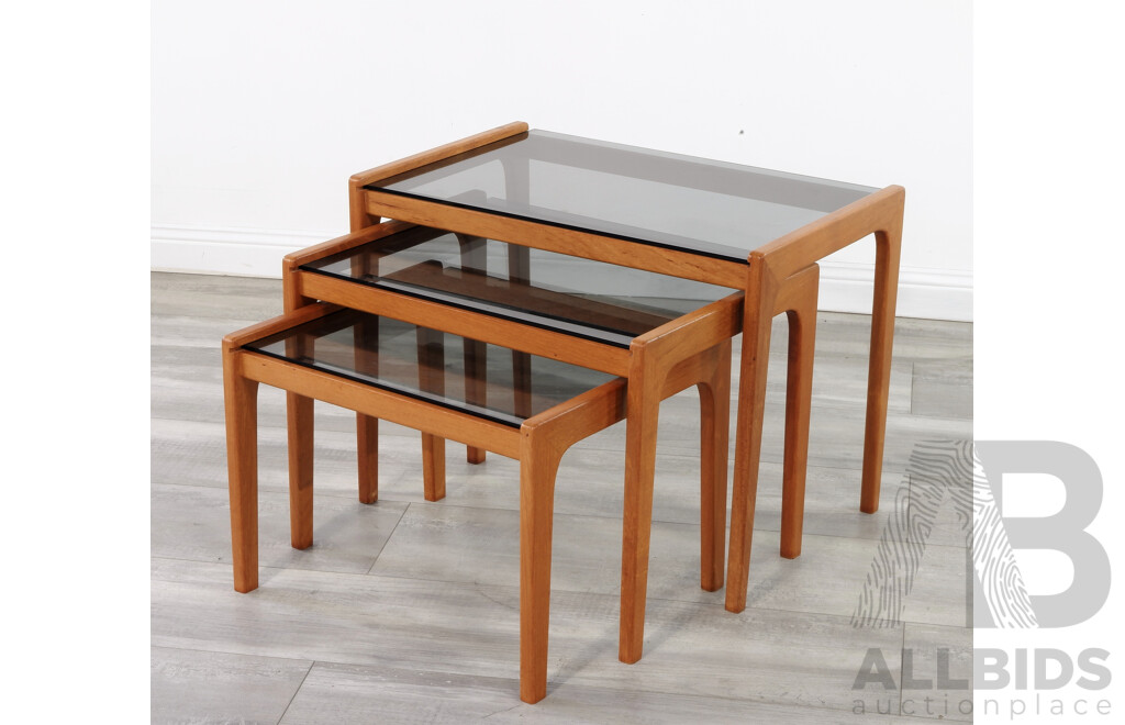 A Mid Century Set of Glass Top Nesting Tables