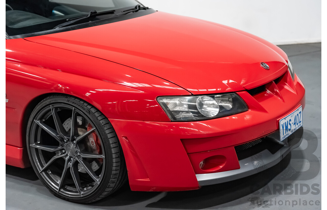 3/2004 Holden HSV Clubsport R8 VY II 4d Sedan Sting Red 5.7L - Supercharged