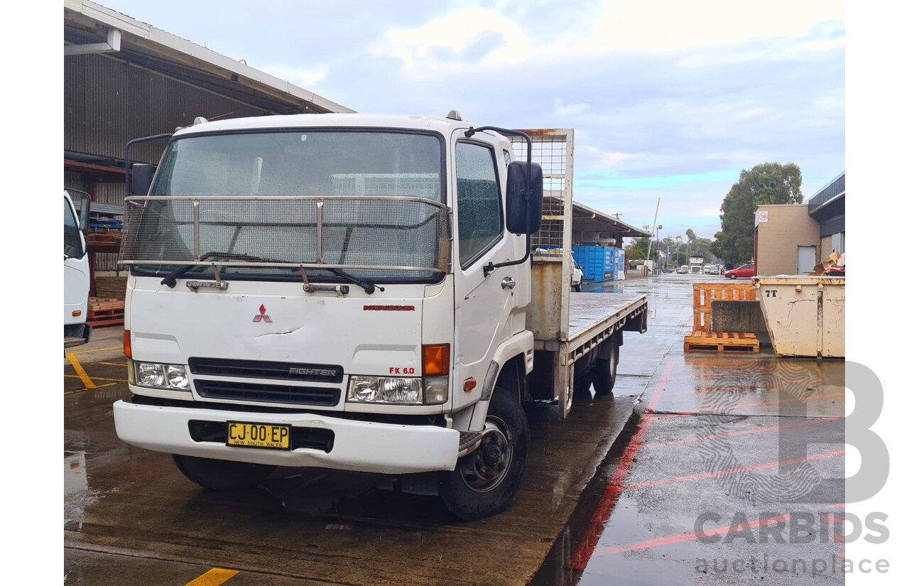 09/2004 Mitsubishi FK 600 Rigid Flat Bed Tray Truck