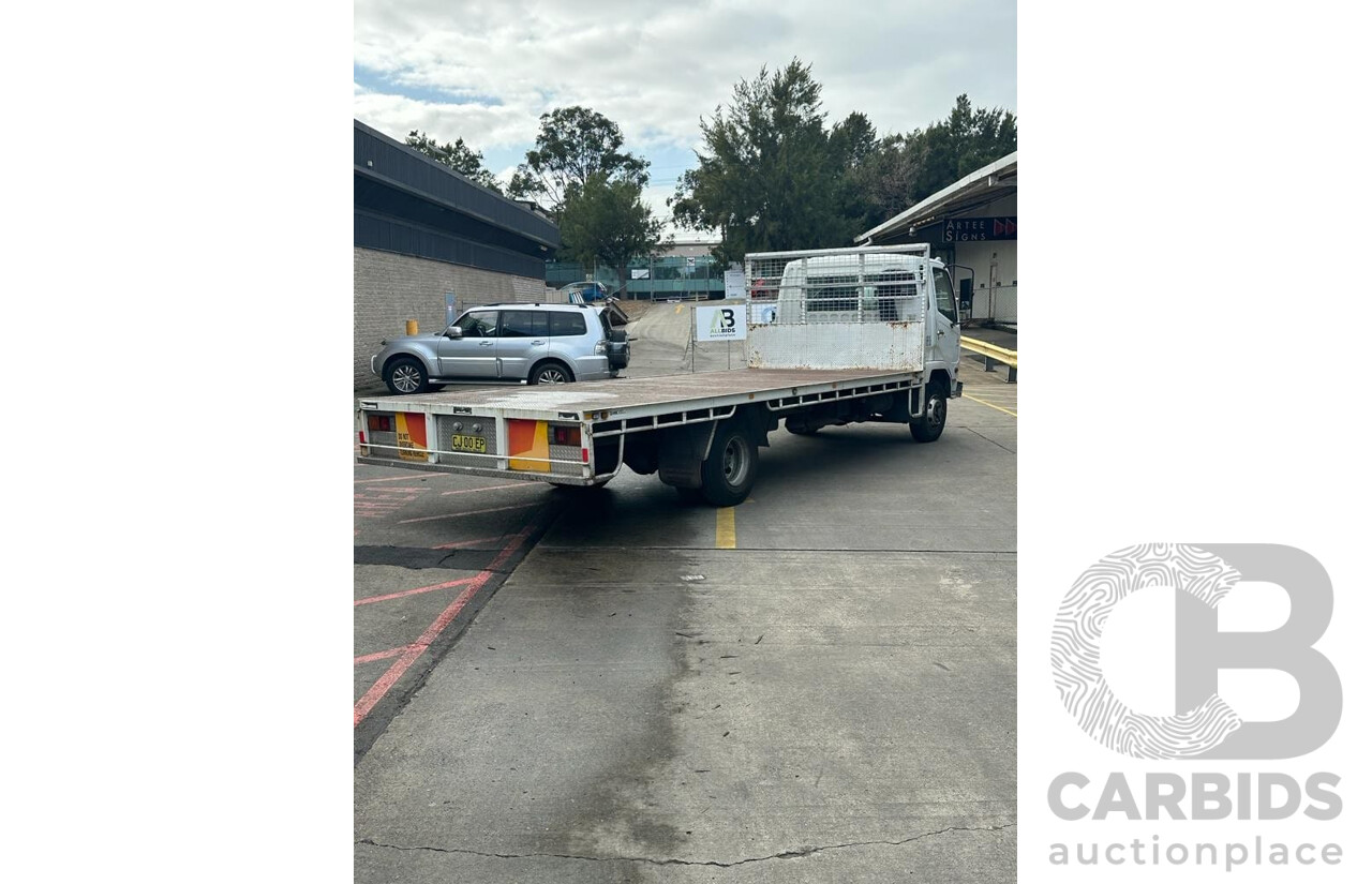 09/2004 Mitsubishi FK 600 Rigid Flat Bed Tray Truck