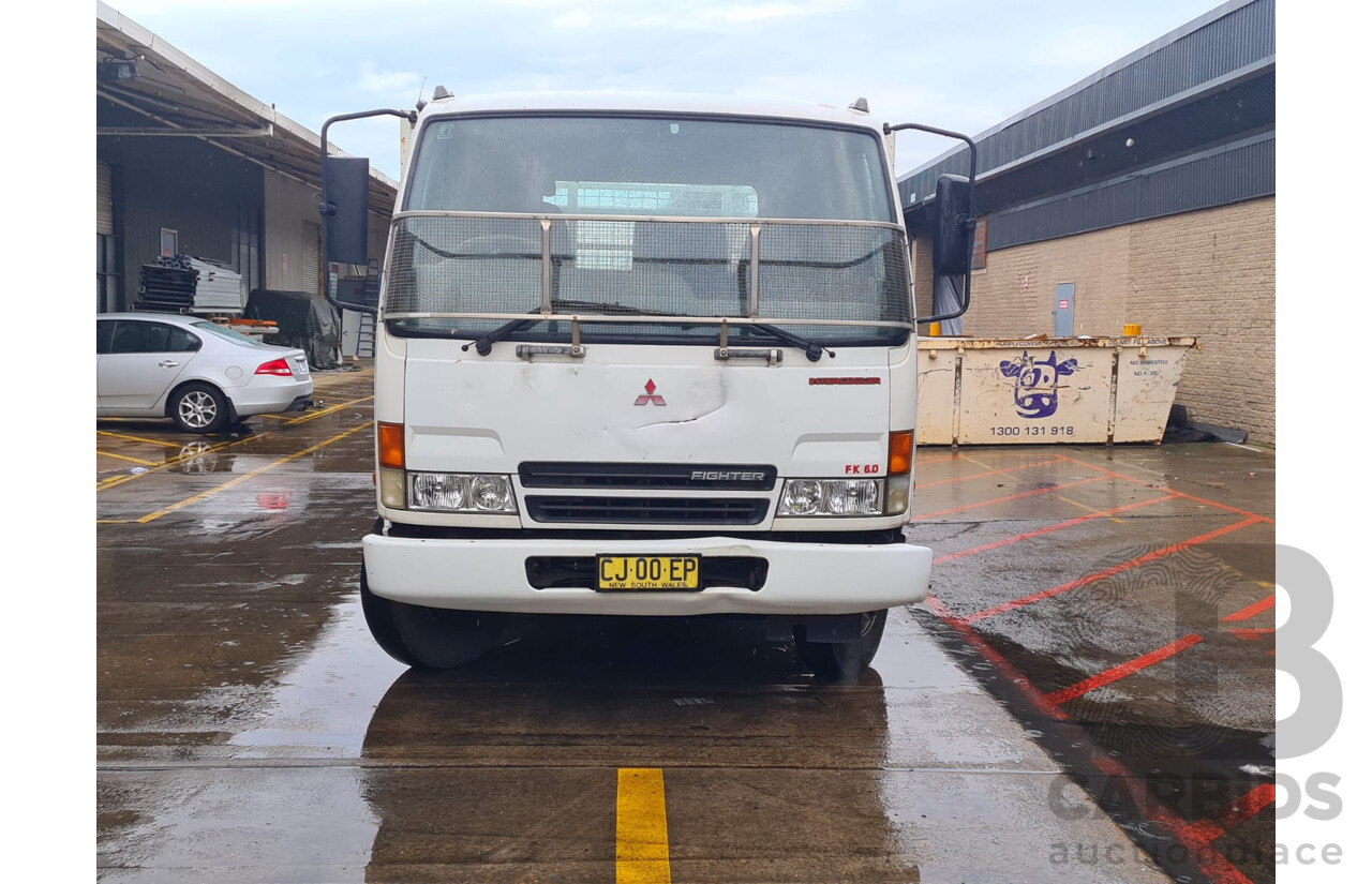09/2004 Mitsubishi FK 600 Rigid Flat Bed Tray Truck
