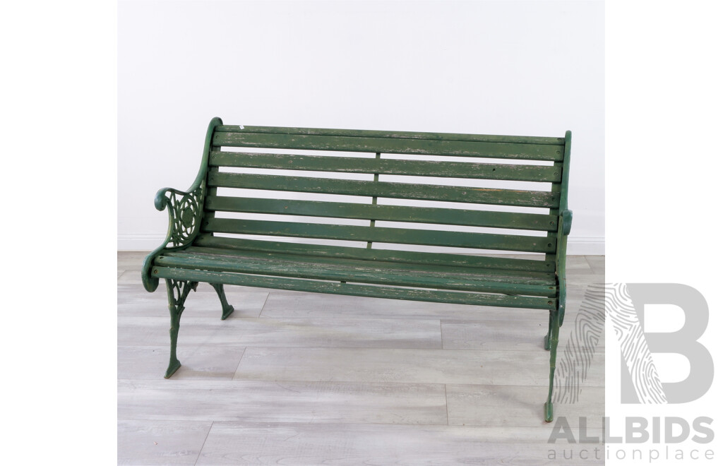 A Painted Cast Iron Garden Bench