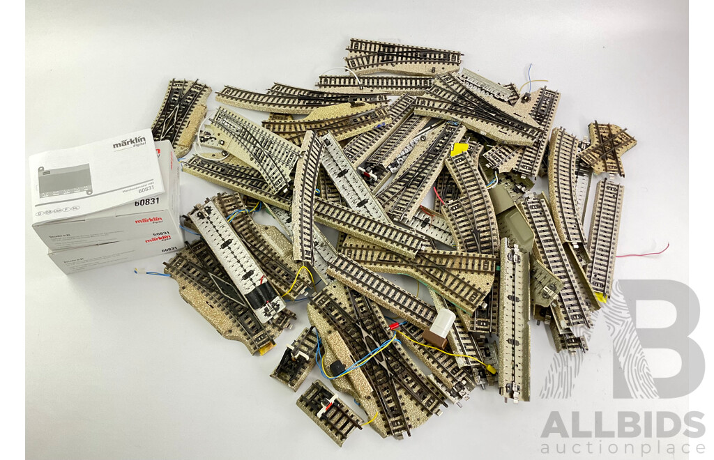 Collection of Marklin HO Scale Track Pieces Including Points, Straights and Curves