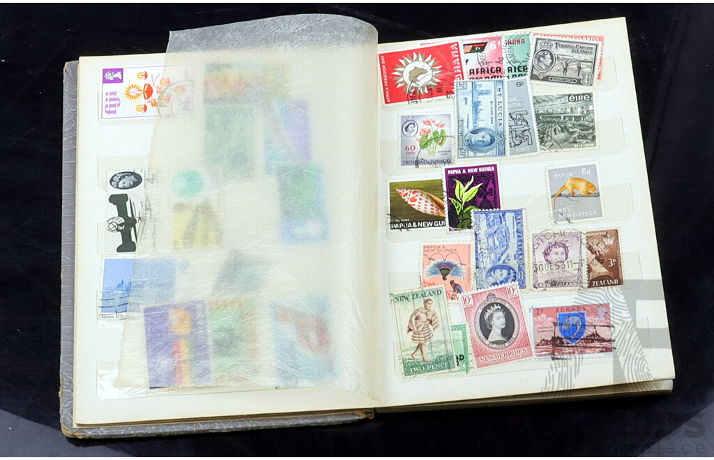 Collection of International Cancelled Stamp Albums From Singapore, United Kingdom, Netherlands and Many More