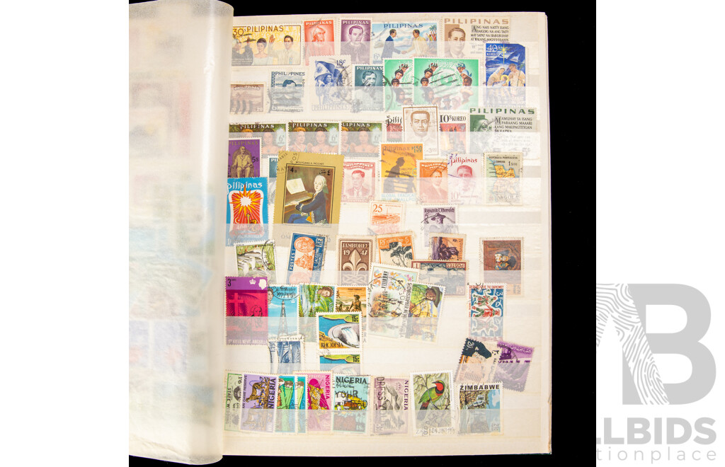 Album of Cancelled International Stamps Including Malaya, Canada, Zimbabwe, Germany, Philippines, Fiji, Italy, Poland, South Africa and More
