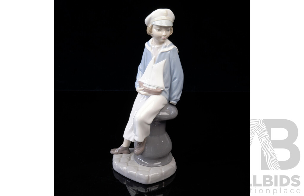 Lladro Porcelain Figure of Boy on Bollard with Toy Ship, Marked to Base
