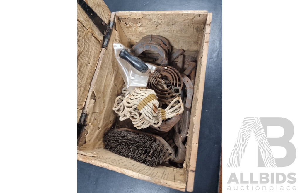 Rustid Hinged Storage Box with a Collection of Horse Shoes and Tools