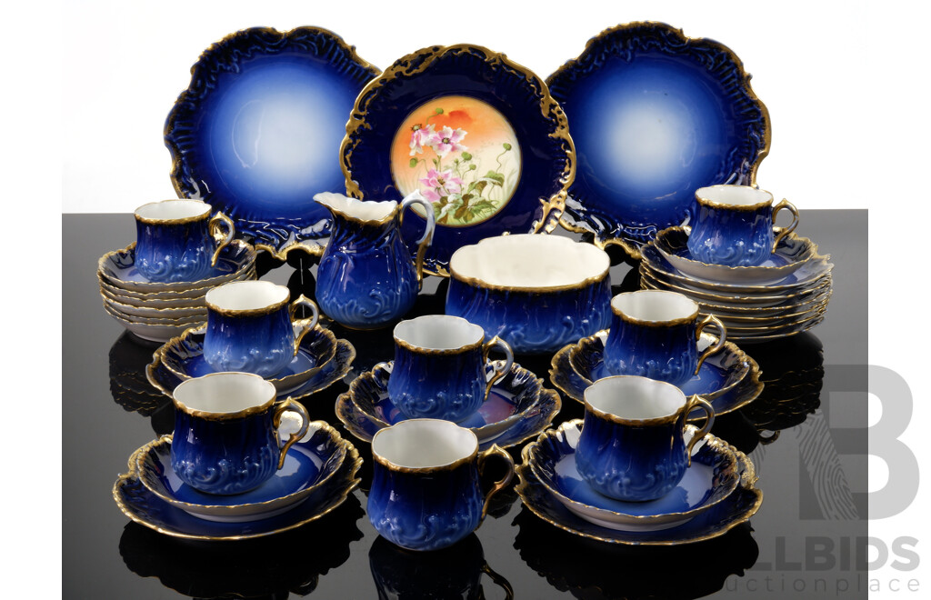 Antique French Limoges by M Redon 36 Piece Porcelain Tea Service with Textured Gilt Edge and Deep Blue Glaze, Marks to Rear