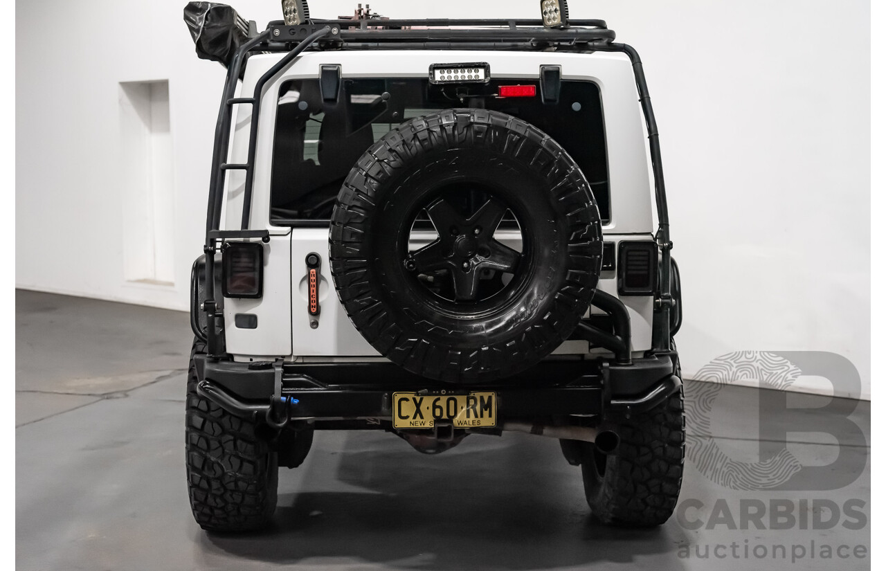 3/2011 Jeep Wrangler Unlimited Rubicon (4x4) JK MY11 4d Softtop White 3.8L - Modified