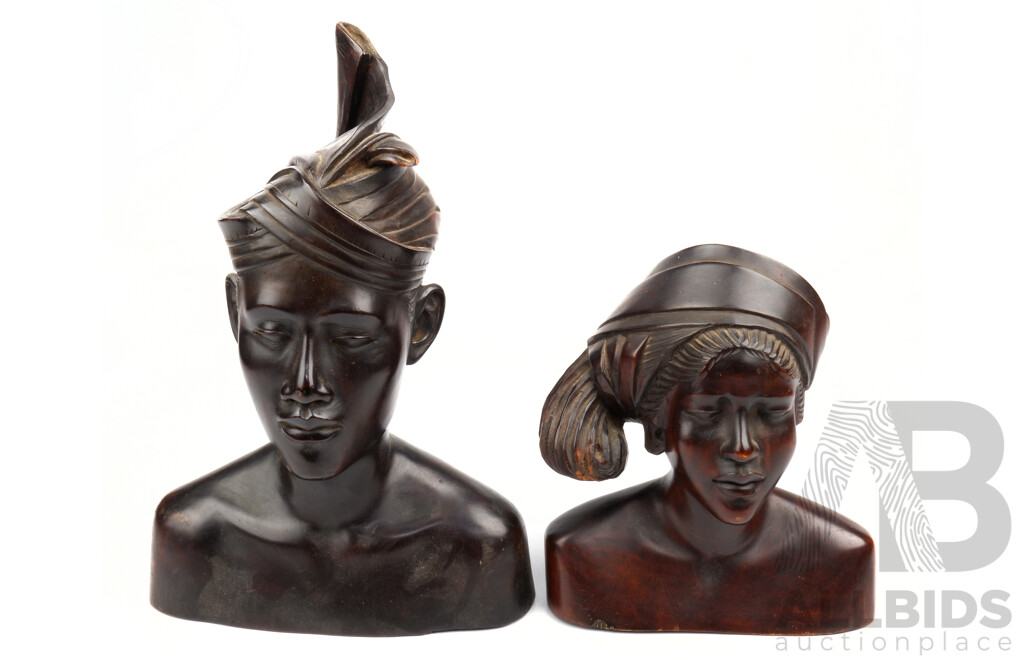 Two Hand Carved Indonesian Male and Female Wooden Busts
