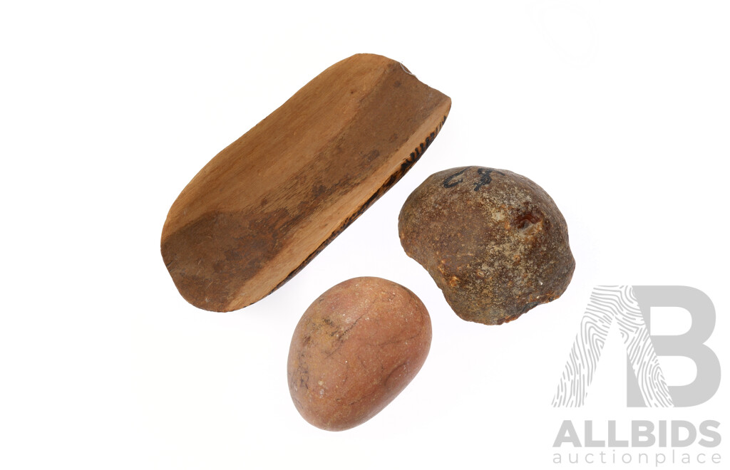 Australian Indigenous Wooden Coolomon with Pokerwork Decoration Along with Two Ancient Rocks