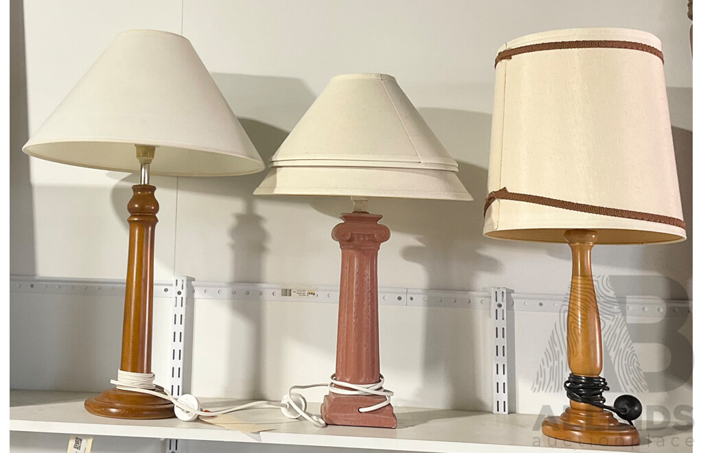 Two Timber Table Lamps, a Ceramic Column Lamp and Two Spare Shades