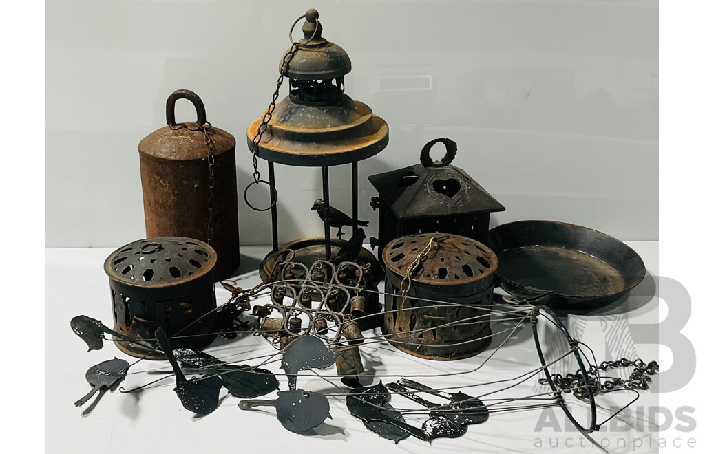 Collection of Vintage Outdoor Hangers Including Cast Iron Candle Holders, Cow Bell, Bird Feeder and Wind Chimes